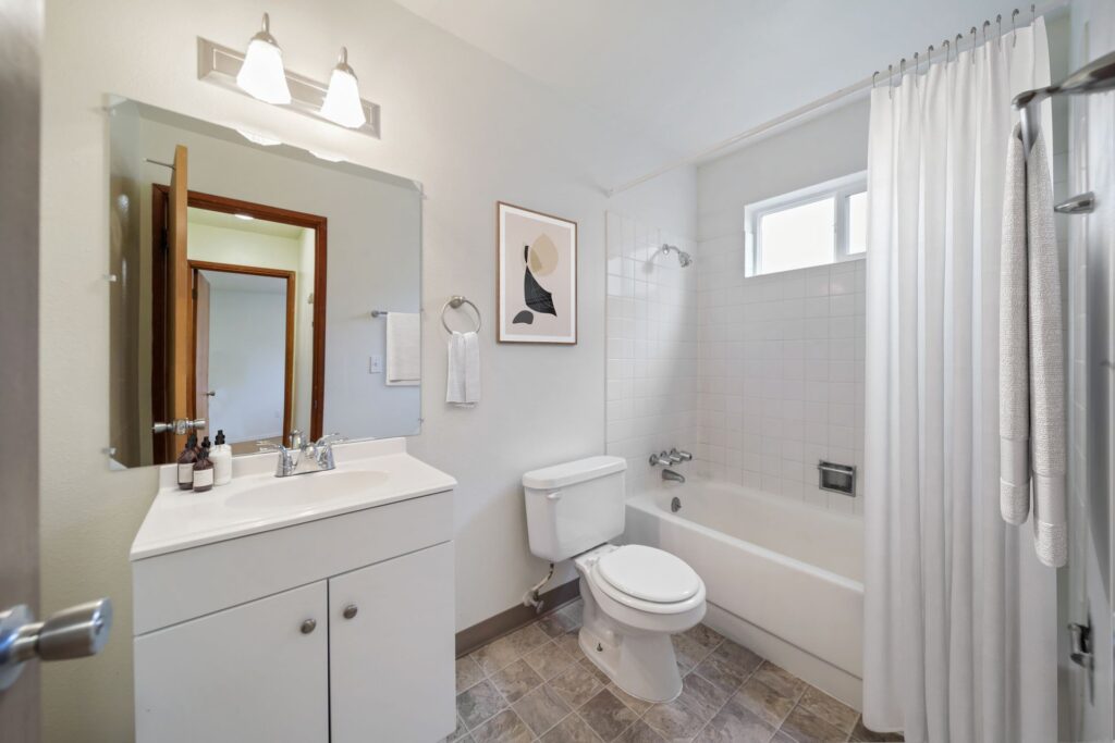 Full bathroom with tub and shower in a Cherry Tree apartment home
