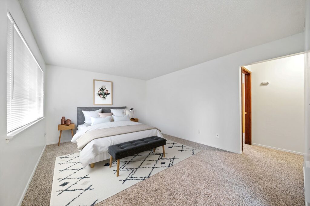 Bedroom with a walk-in closet in a Cherry Tree apartment home